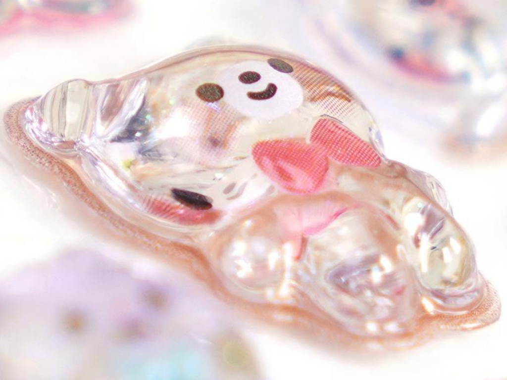 Side view of a raised pink character bubble sticker