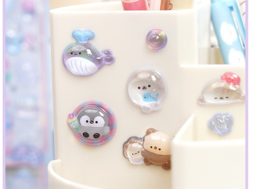 Animal bubble stickers decorating a white pen holder