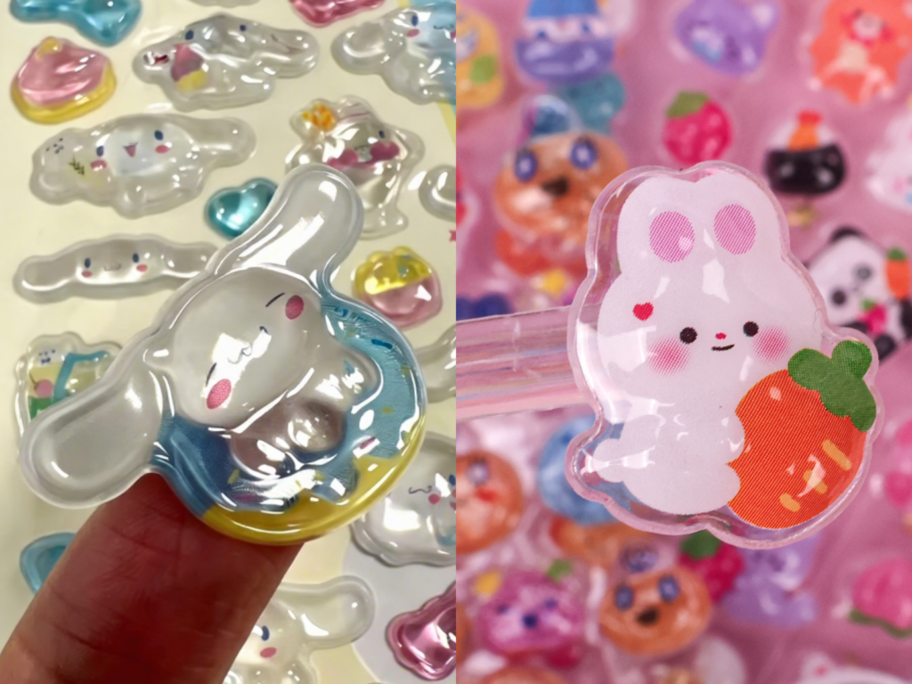 Side-by-side close-ups of a shiny character bubble sticker and a pink rabbit design