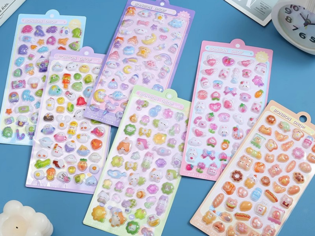 Colorful bubble sticker sheets arranged on a blue background