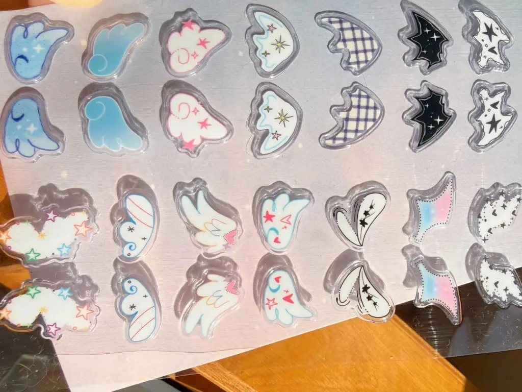 Assorted clear puffy sticker sheets showing different printed layouts and sticker shapes.