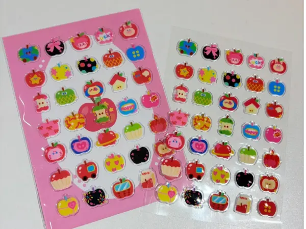 Custom clear puffy sticker sheets shown with a printed backing card and on a transparent liner.