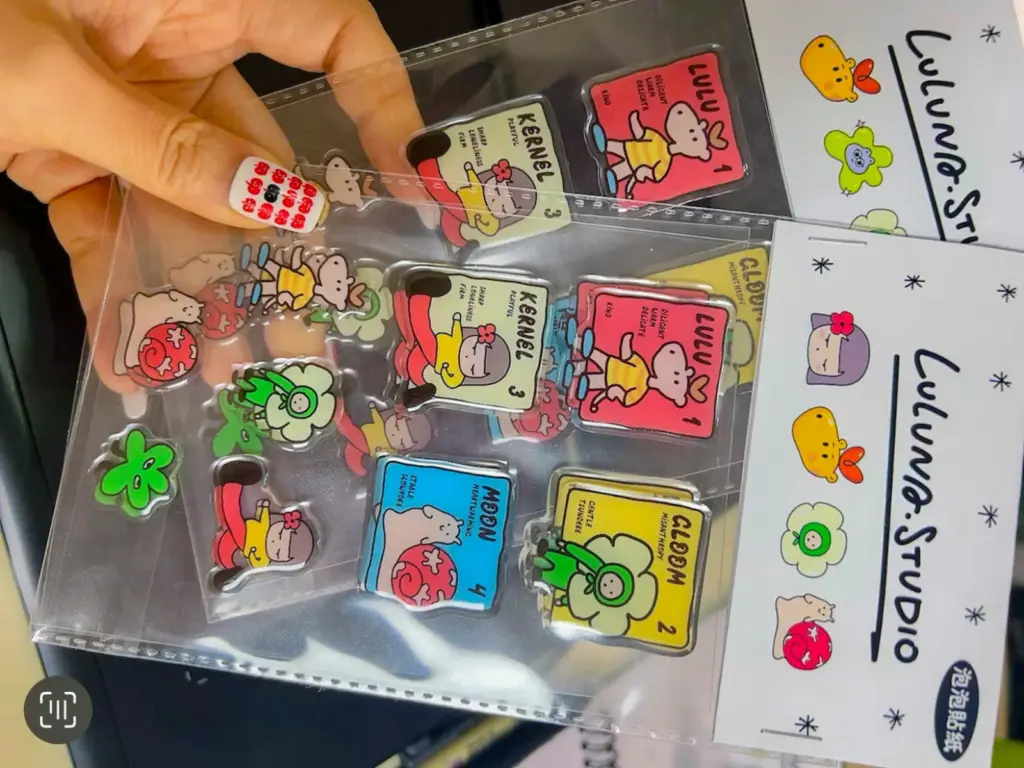 Custom clear puffy sticker sheets in clear bags with printed fold-over header cards.