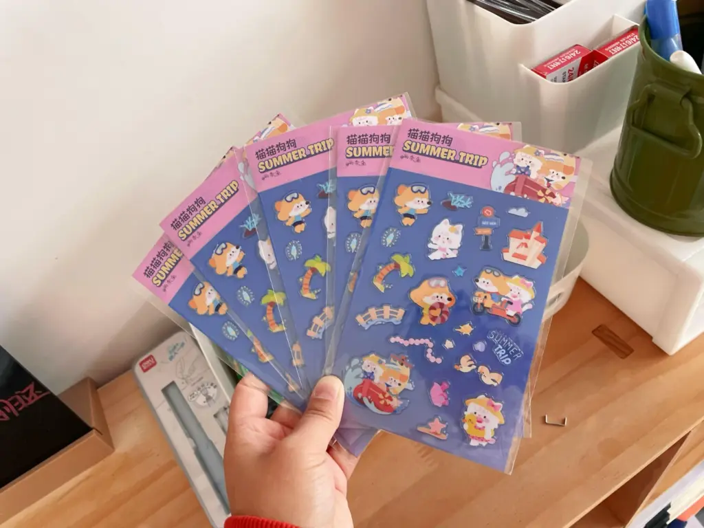 Custom clear puffy sticker sheets in clear retail bags with printed backing cards and header cards.