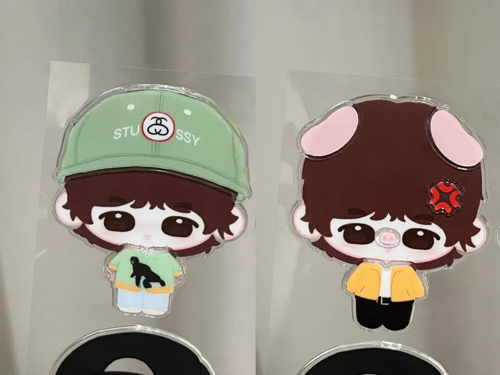 Close-up of two clear puffy stickers showing printed designs surrounded by transparent borders.