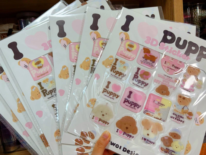 Custom domed epoxy sticker sheets with raised 3D resin finish and assorted printed designs