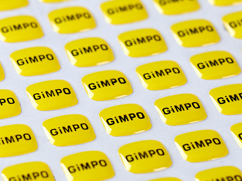 Yellow domed labels supplied together on a backing sheet