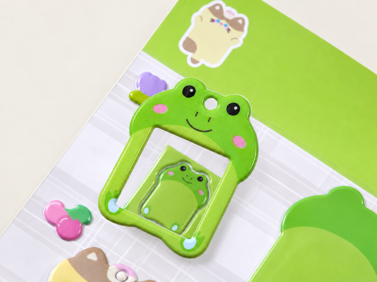 Foam puffy sticker with a die-cut photo frame shape and matching retail backing card.