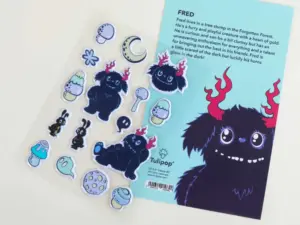 Multi-design foam puffy sticker sheet on a transparent liner beside its printed backing card