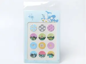 Round kiss-cut puffy sticker sheet sealed in a clear OPP bag with an extended backing card