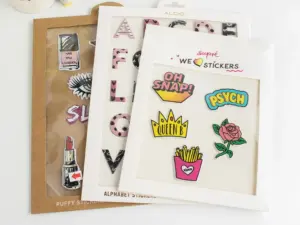 Raised foam puffy sticker sets packaged with custom printed window display cards