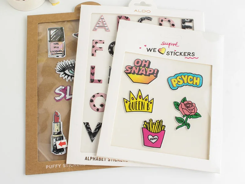 Raised foam puffy sticker sets packaged with custom printed window display cards