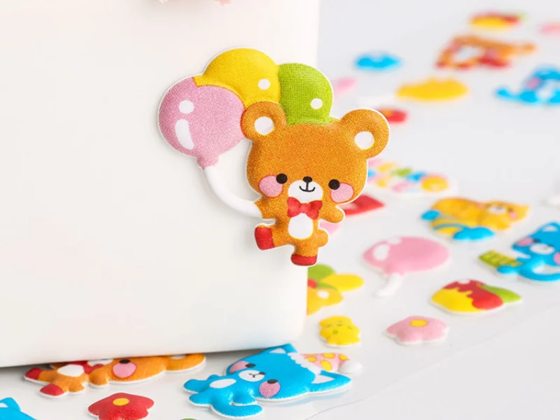 Macro close-up of a matte foam puffy sticker with multi-level sculpted raised details